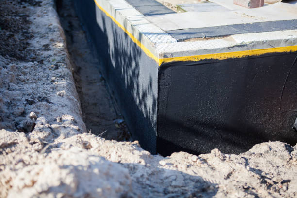 Professional Waterproofing technician working in Smithville, OH